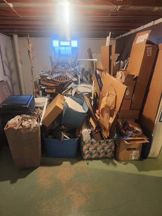 Roll-off dumpster container at job site for Yard Waste Dumpster Rental in Clinton